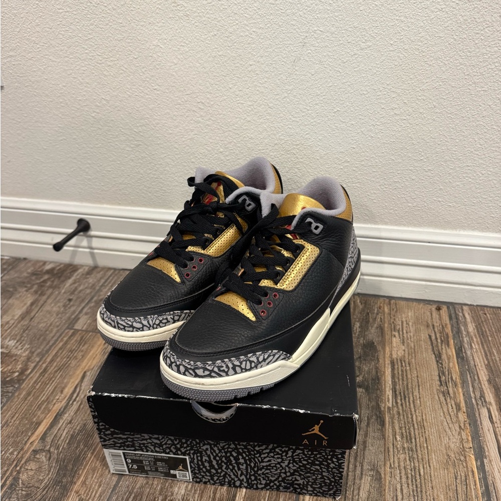 Jordan Black and Gold Sneakers